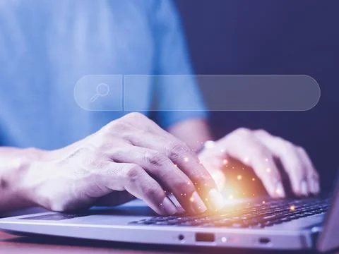 Data Search Technology Search Engine Optimization. man's hands are using a co Stock Photos