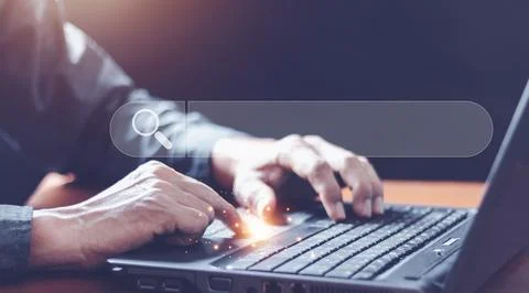 Data Search Technology Search Engine Optimization. man's hands are using a .. Stock Photos