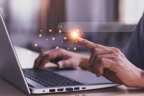 Data Search Technology Search Engine Optimization. man's hands are using a .. Stock Photos