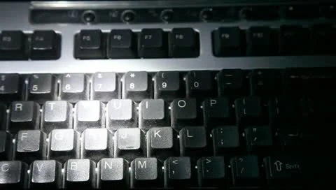 Data security breach and computer spy hacker with flashlight and keyboard 動画素材 10804057