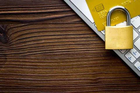 Data security concept with credit card on wooden table top view copy space Stock Photos