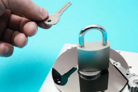 Data security concept. Cyber security concept with a padlock on hard disk. .. Stock Photos