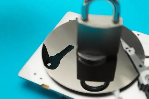 Data security concept. Cyber security concept with a padlock on hard disk. .. Stock Photos