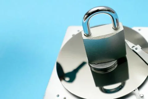Data security concept. Cyber security concept with a padlock on hard disk. .. Stock Photos