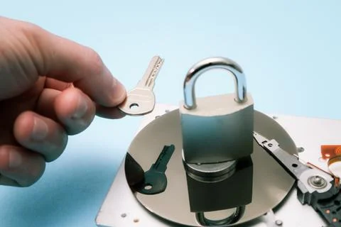 Data security concept. Cyber security concept with a padlock on hard disk. .. Stock Photos