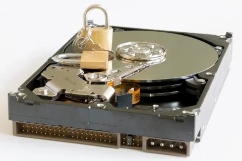 Data Security: Lock Sitting On A Hard Disk Drive Stock Photos