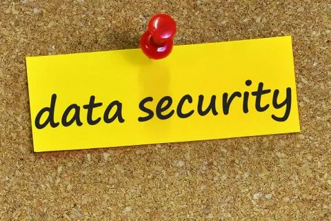 Data security word on yellow notepaper with cork background Stock Photos