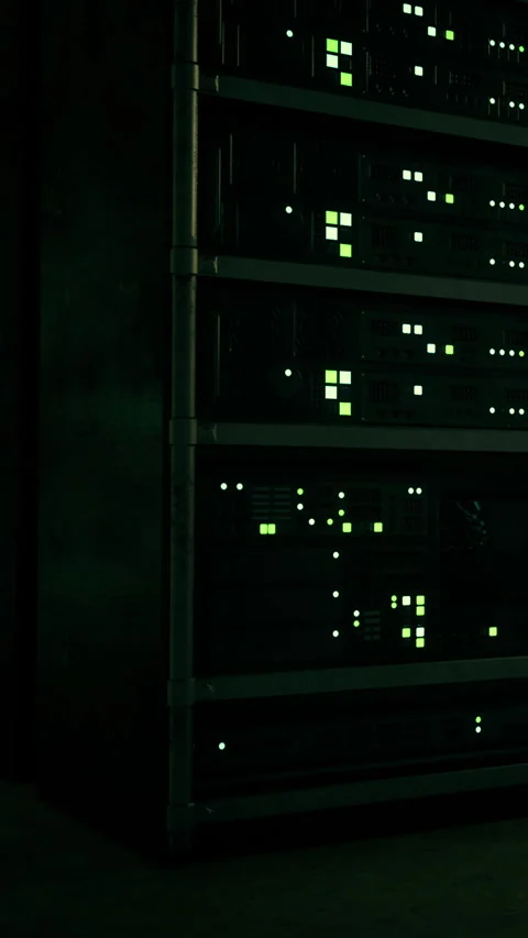 Data servers glow green in a dark server room at night Stock Footage 334167313