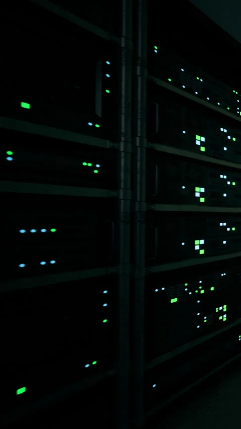 Data servers glowing in a dark server room during technology operations Stock Footage 336172195