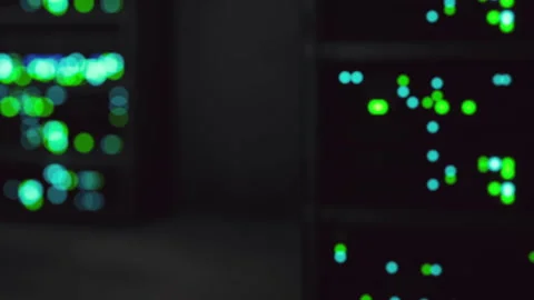 Data servers light up in a technology center during nighttime operations Stock Footage 345003509