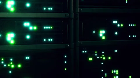 Data servers light up in a technology setting during an evening scene Stock Footage 345003673
