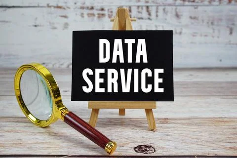 Data Service text written on paper with magnifying glass Foto stock