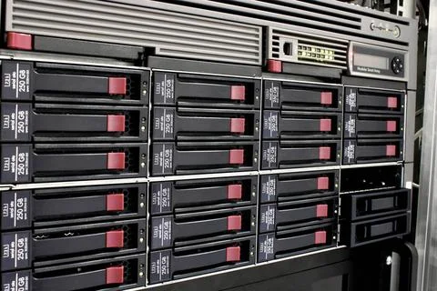 Data storage rack servers stack with hard drives in a datacenter for backu... Stockfoto's