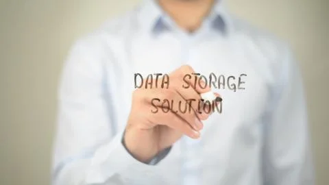 Data Storage Solution , man writing on transparent screen 스톡 사진