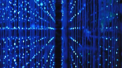 Data stream flowing through a network of blue light technology in an immersive Stock Photos