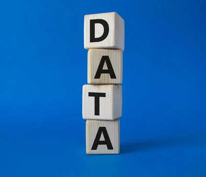 Data symbol. Concept word Data on wooden cubes. Beautiful blue background. .. Foto stock