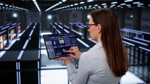 Data Technician Checks Secure Servers Carefully Stock Footage 330587762