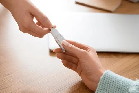 Data transfer and information sharing with USB flash drive between two people Stock Photos