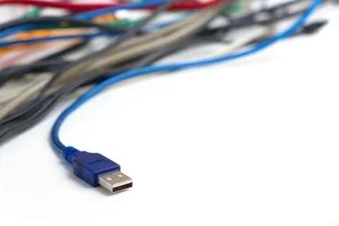 Data transfer computer connector with tangled cables on white background.  Stock Photos
