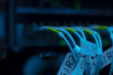 Data transfer by optical fibre on core network switch. selective focus shot Stock Photos