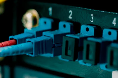 Data transfer by optical fibre on core network switch. selective focus shot Stock Photos
