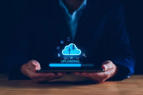 Data upload to cloud storage computing concept. Man using smartphone and co.. Stock Photos