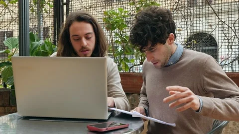 Data Verification: Colleagues at the Bar with Laptop Stock Footage 262321917