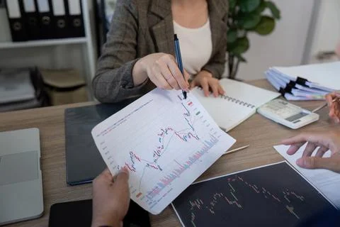 Data Visualization and Strategy. A business meeting featuring detailed charts Stock Photos