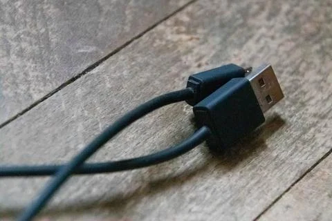 Data wire close up on wood background. Stock Photos