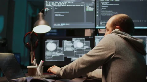 Database admin answering landline phone call late at night Stock Footage 224581514