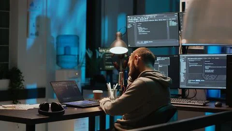 Database admin feeling tired and drained at office job Stock Photos