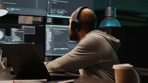 Database admin having fun listening to music on headset Stock Footage 229335425