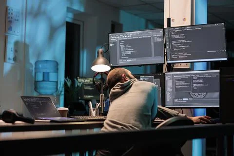 Database admin typing programming code on computer Foto stock