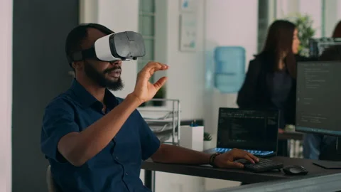 Database admin working with virtual reality glasses to develop server app Stock Footage 220895162