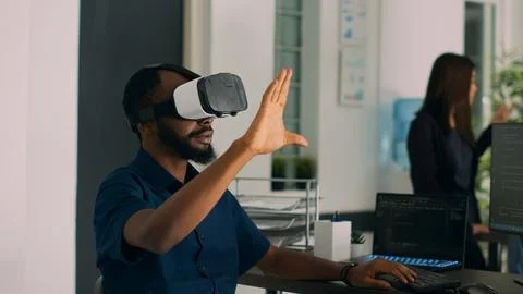 Database admin working with virtual reality glasses to develop server app Stock Photos
