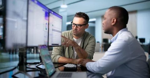 Database Administrator And Developer Collaborate Reviewing SQL Query Results  스톡 사진