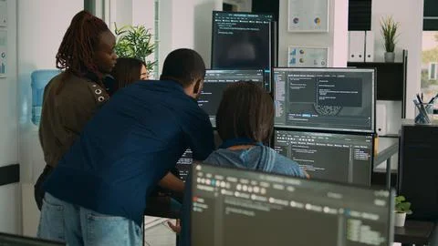 Database admins collaborating on group project compiling algorithm 写真素材