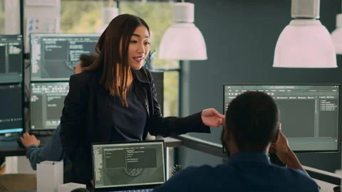 Database admins doing highfive gesture to celebrate coding achievement Stock Footage 221375531