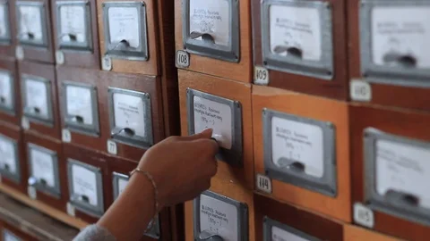 Database concept. human hand opens library card or file catalog box. Stock Footage 98488975
