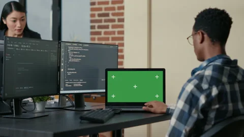 Database designer writing code using laptop with green screen chroma key mockup Stock Footage 168250734