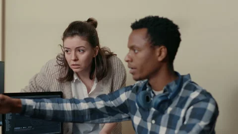 Database developer analyzing compiling code on multiple screens takes off Stock Footage 168245049