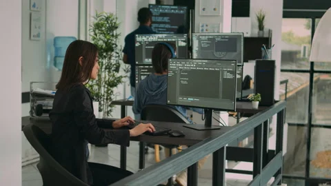 Database developer using computer to write code on terminal window Stock Footage 231449764