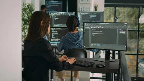 Database developer using computer to write code on terminal window 스톡 사진