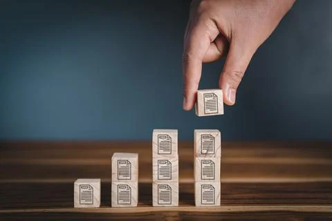 Database Documentation Files Management Trend Concept, Hand is Putting Wooden Stock Photos