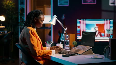 Database engineer student writing code for improving network or debugging server Stock Footage 265341638