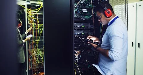 Database, inspection and tablet with IT professional in server room for Stock Photos