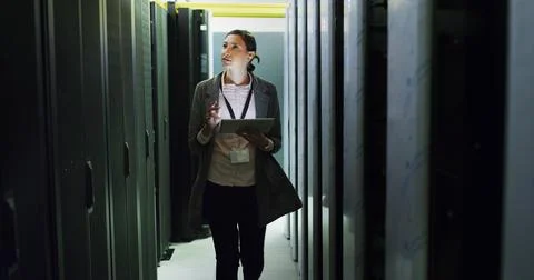 Database, inspection and tech support with woman in server room for Stock Photos
