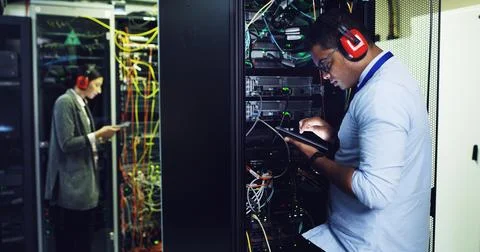 Database, maintenance and tablet with IT professional in server room for Stock Photos