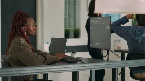 Database programer writing source code and script on terminal window Stock Footage 220380057