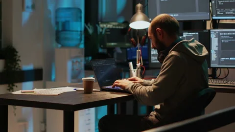 Database programmer typing server code on multiple screens Stock Footage 224580526